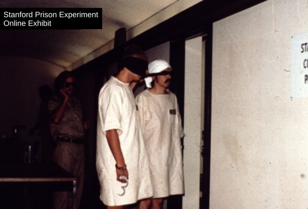 Rich and others blindfolded while being led back to their cells.