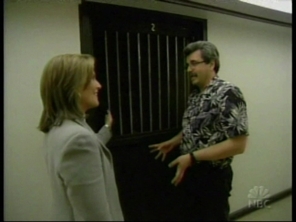 Rich standing with NBC Dateline reporter Sara James in front of reconstructed prison cell.